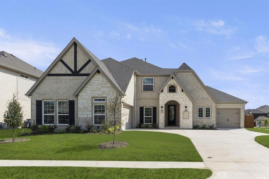 Front exterior of a new home in Woodcreek, Rockwall, TX, highlighting curb appeal (Image 18).