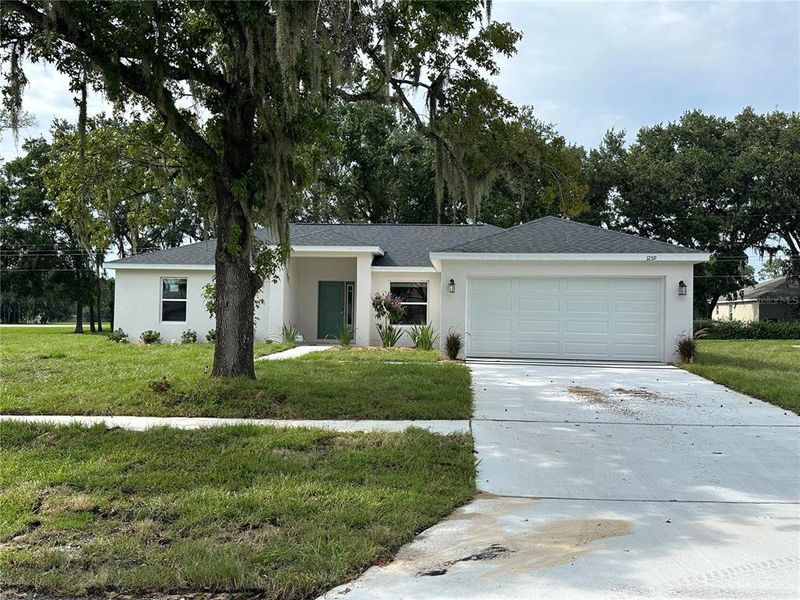Front exterior of a new home in , Lakeland, FL, highlighting curb appeal (Image 12). Front exterior of a new home in , Lakeland, FL, highlighting curb appeal (Image 12).
