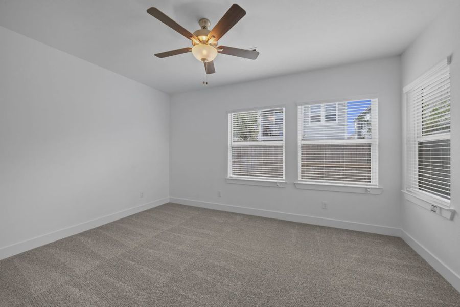 Representative unfurnished interior of a home built from the Carriagehouse by Chesmar Homes in Meridiana Townhomes, Iowa Colony (Image 86).