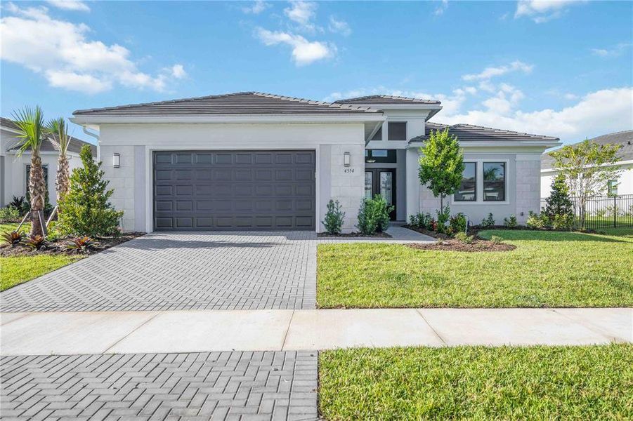Front exterior of a new home in , Sarasota, FL, highlighting curb appeal (Image 23). Front exterior of a new home in , Sarasota, FL, highlighting curb appeal (Image 23).