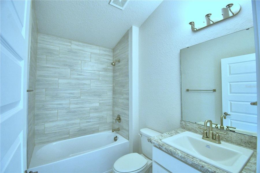 Furnished interior view inside a new home in Magnolia Park, Haines City (Image 8).