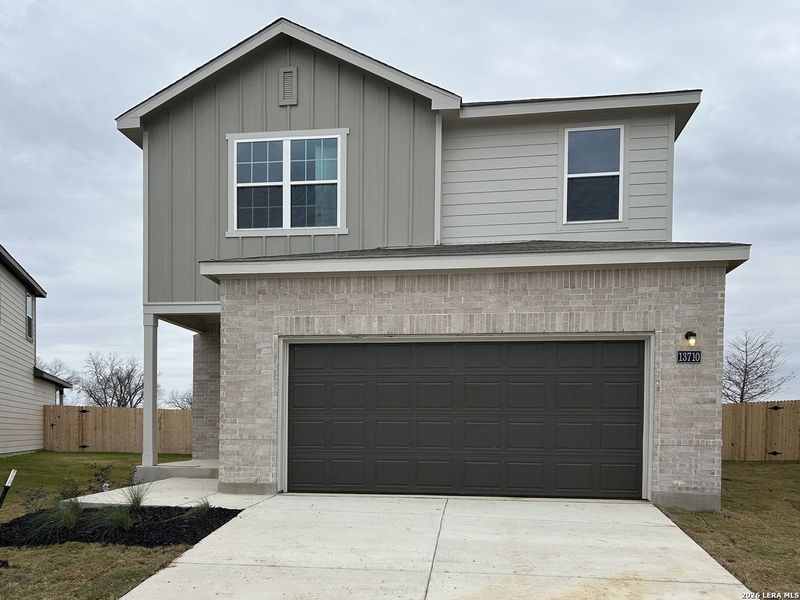 Front exterior of a new home in Meadows at Hennersby Hollow 40's, San Antonio, TX, highlighting curb appeal (Image 2). Front exterior of a new home in Meadows at Hennersby Hollow 40's, San Antonio, TX, highlighting curb appeal (Image 2).