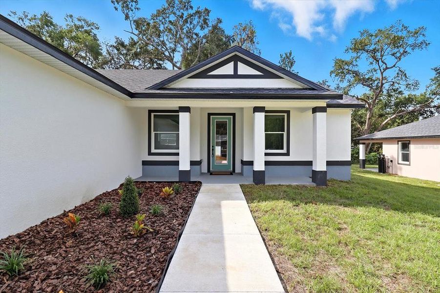 Front exterior of a new home in , Inverness, FL, highlighting curb appeal (Image 22).
