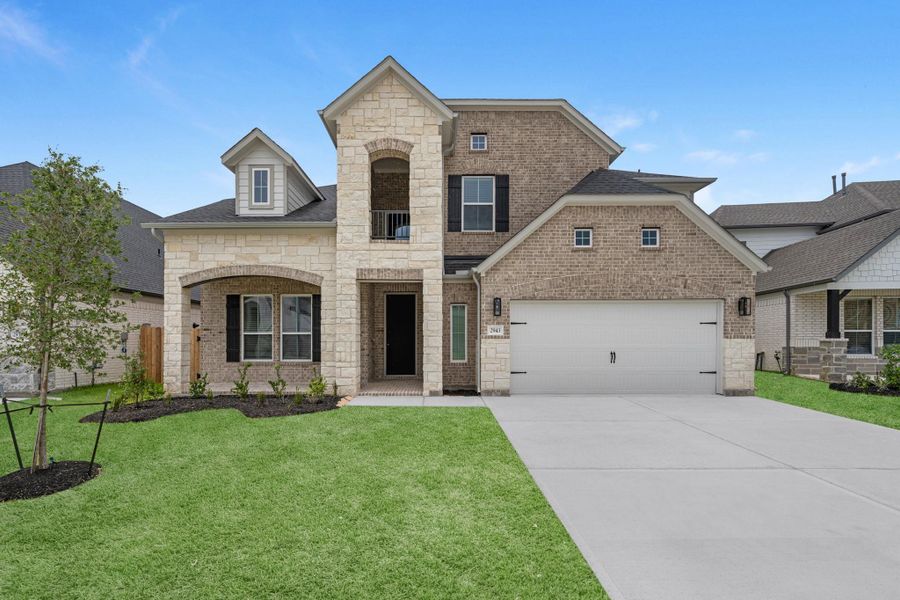 Front exterior of a new home in Morton Creek Ranch, Katy, TX, highlighting curb appeal (Image 21). Front exterior of a new home in Morton Creek Ranch, Katy, TX, highlighting curb appeal (Image 21).