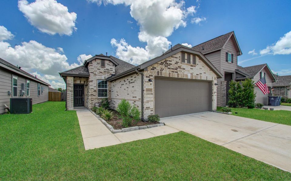 Charming single-story home with a brick facade and attached two-car garage. Features a neatly manicured lawn and a welcoming front entrance. Charming single-story home with a brick facade and attached two-car garage. Features a neatly manicured lawn and a welcoming front entrance.