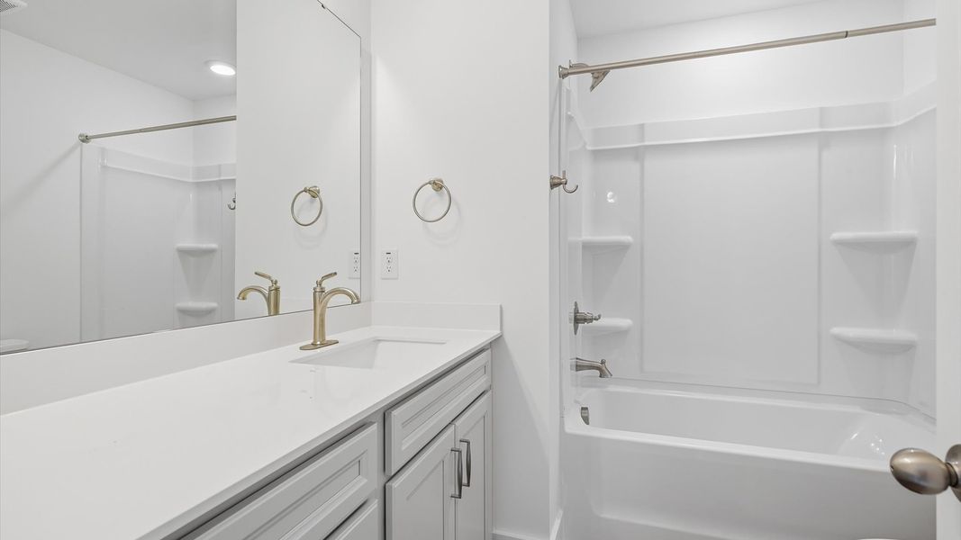 Top-notch bathroom with current fixtures, tasteful materials, and elevated charm in Arden, NC
