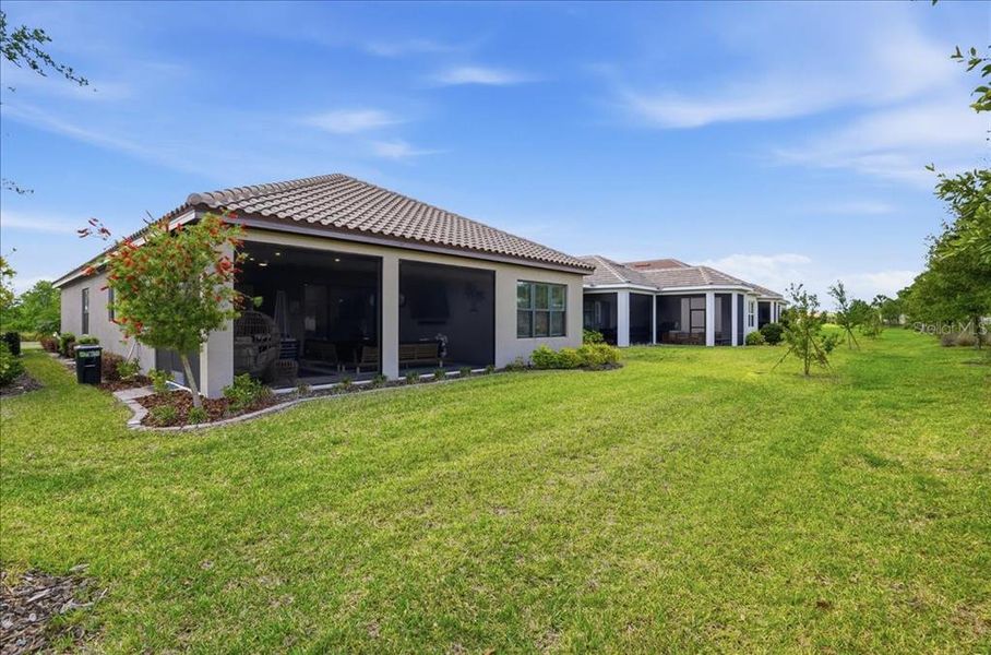 Exterior details and patio area of a home in Esplanade at Artisan Lakes, Palmetto (Image 23).