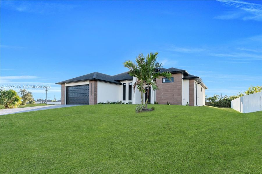 Front exterior of a new home in , Cape Coral, FL, highlighting curb appeal (Image 22).