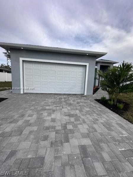 Front exterior of a new home in , Cape Coral, FL, highlighting curb appeal (Image 1).