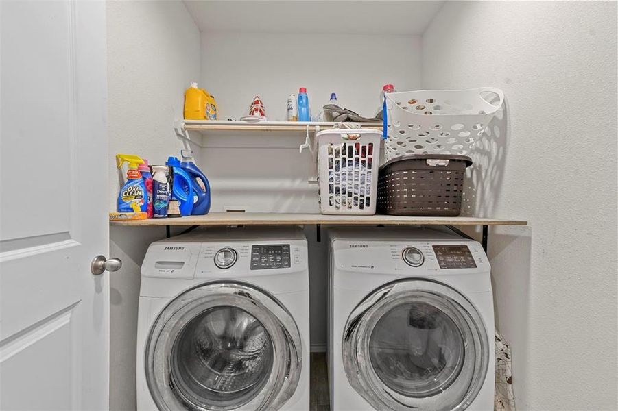 Laundry room featuring washing machine and dryer