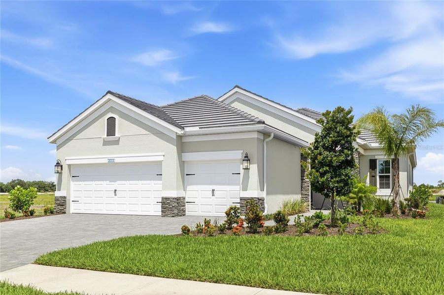 Front exterior of a new home in , Bradenton, FL, highlighting curb appeal (Image 18). Front exterior of a new home in , Bradenton, FL, highlighting curb appeal (Image 18).