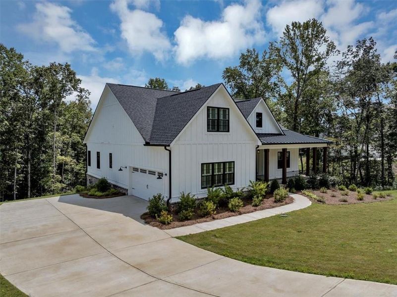 Front exterior of a new home in , Ball Ground, GA, highlighting curb appeal (Image 28).