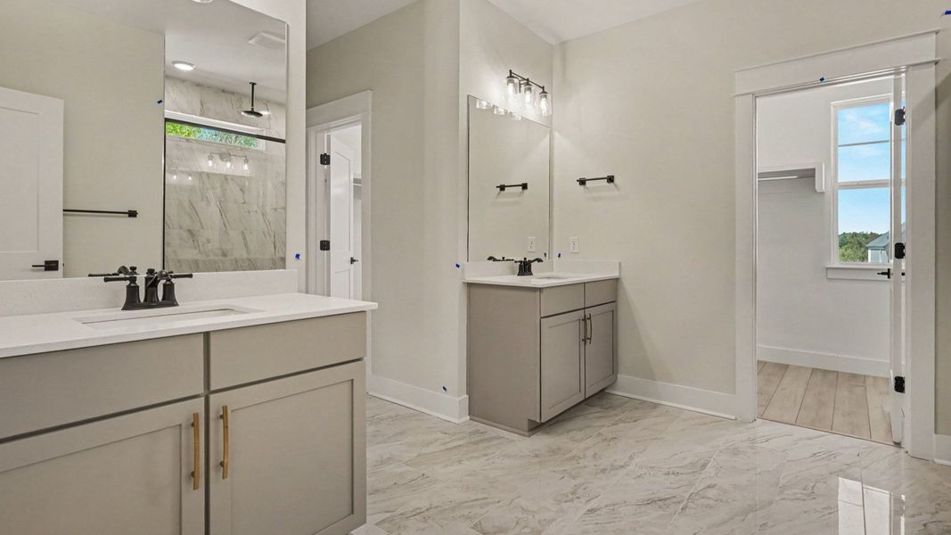Primary bathroom with dual vanities Primary bathroom with dual vanities