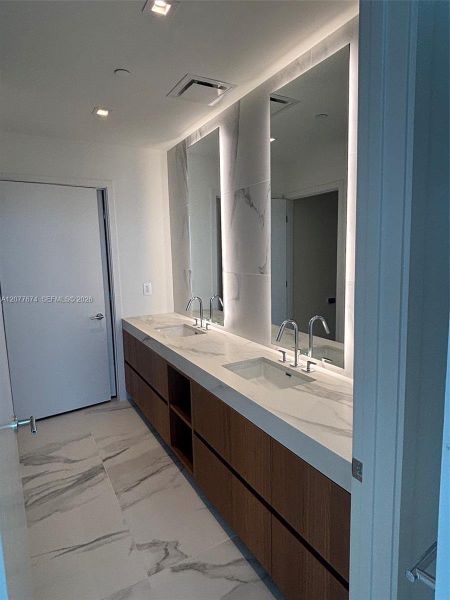 Spa-Inspired Primary Bathroom with Dual Vanity and Bac
