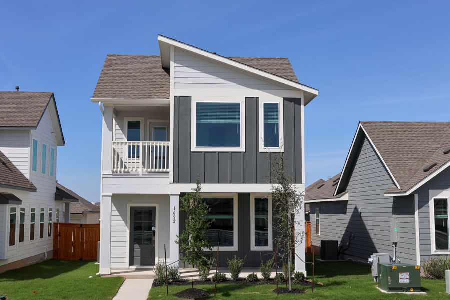 Front exterior of a new home in Trace, San Marcos, TX, highlighting curb appeal (Image 1). Front exterior of a new home in Trace, San Marcos, TX, highlighting curb appeal (Image 1).