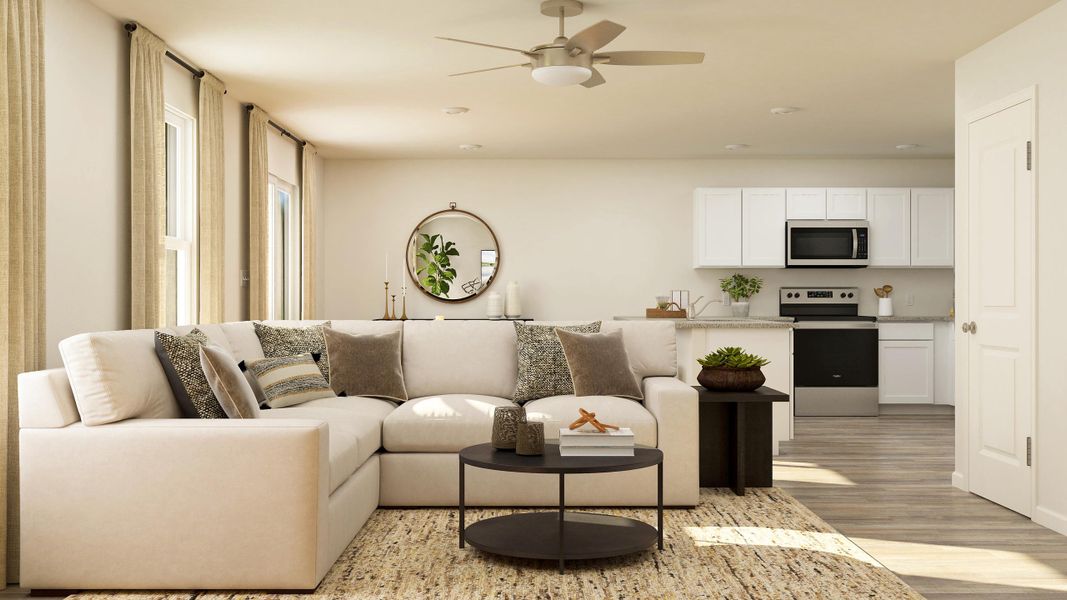 A living room with a white couch and a table.