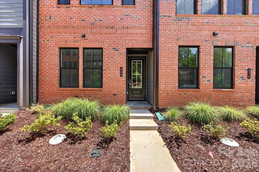 Brick exterior townhome with covered front door Brick exterior townhome with covered front door
