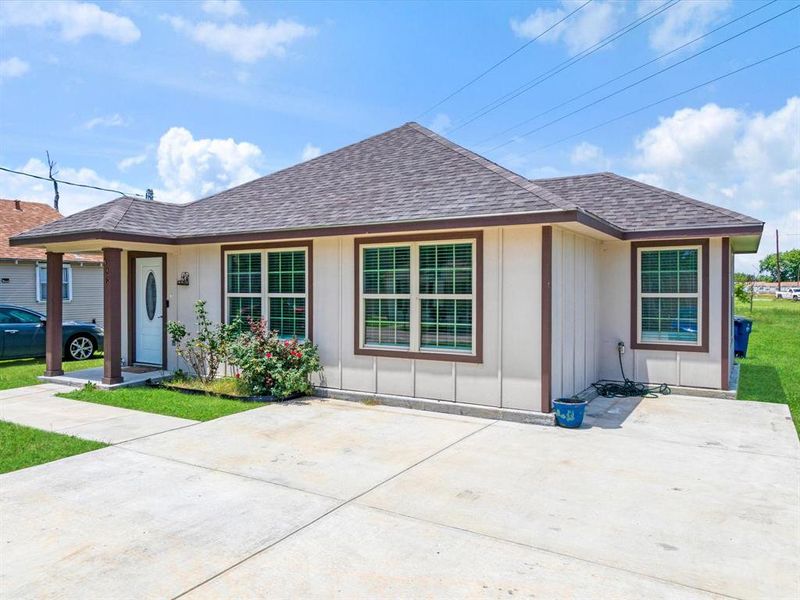 Beige exterior siding with brown trim accents