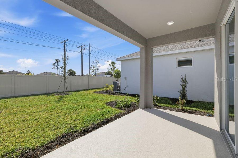 Exterior details and patio area of a home in Indigo Creek, Apollo Beach (Image 4).