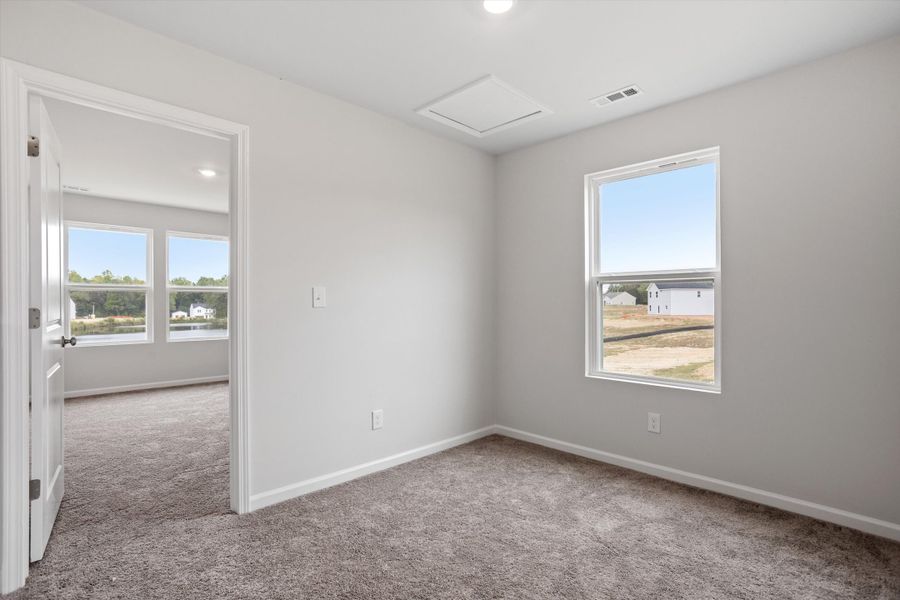 Spacious, unfurnished interior of a new home in Cambridge Reserve, Angier (Image 25).