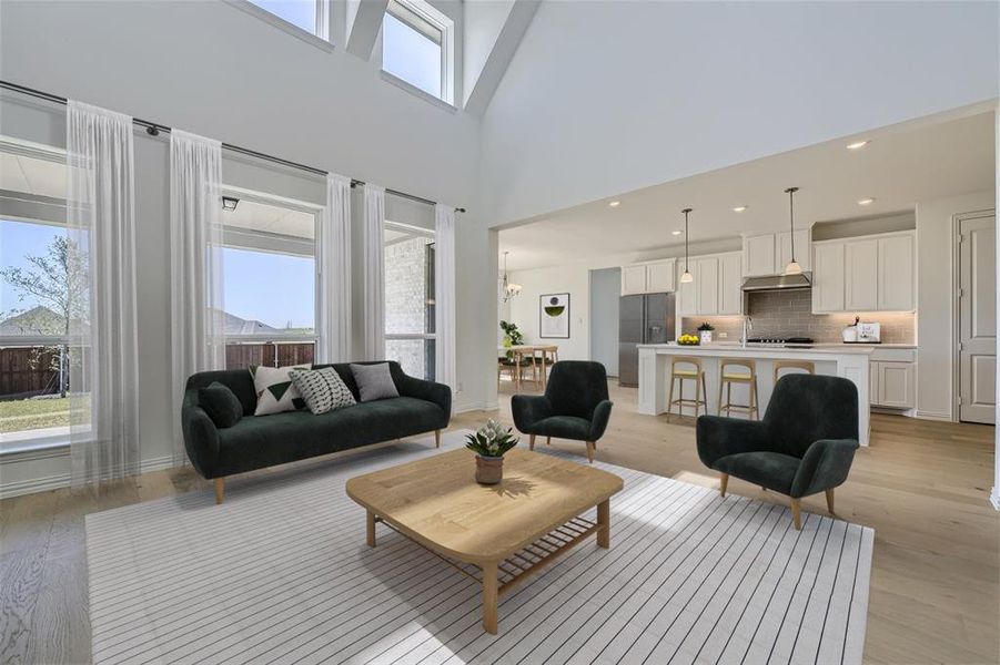 Virtually Staged Photo - Living room with a towering ceiling and light wood-type flooring