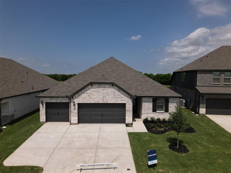 Front exterior of a new home in Lakehaven - Premier Series, Farmersville, TX, highlighting curb appeal (Image 18). Front exterior of a new home in Lakehaven - Premier Series, Farmersville, TX, highlighting curb appeal (Image 18).