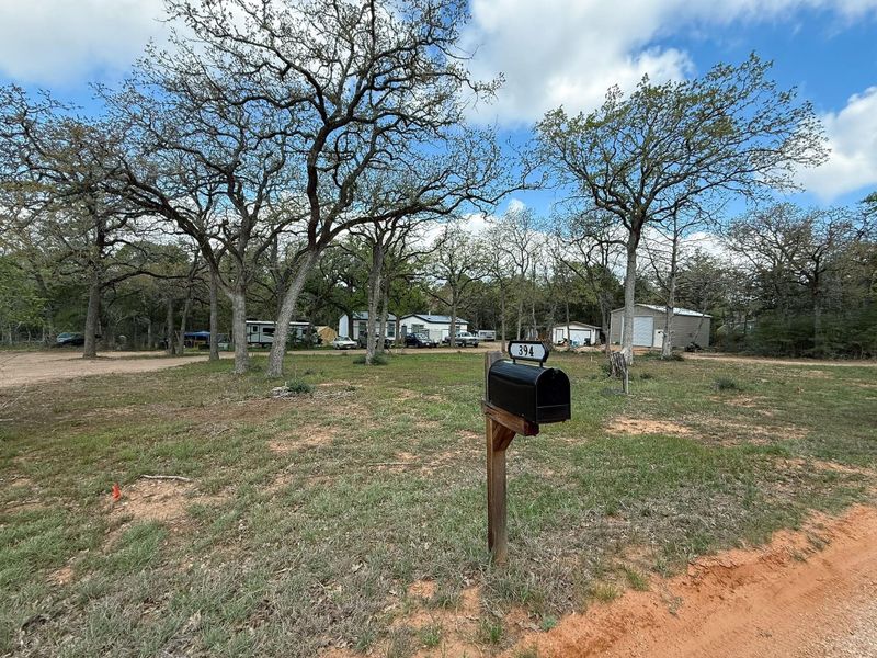 View from road at home, workshop and 2 storage sheds