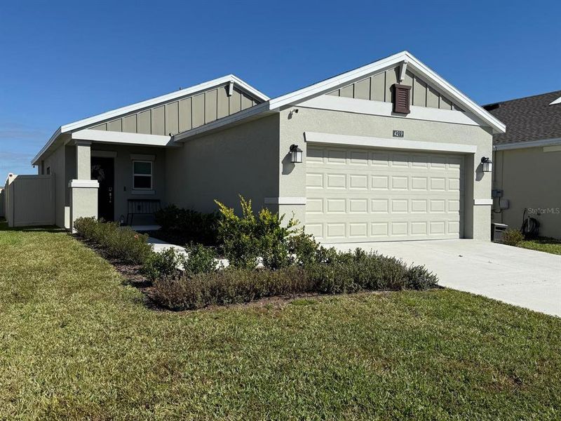 Front exterior of a new home in , Kissimmee, FL, highlighting curb appeal (Image 22).