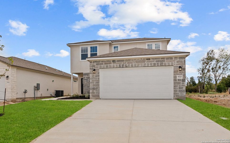 Front exterior of a new home in August Fields, New Braunfels, TX, highlighting curb appeal (Image 21). Front exterior of a new home in August Fields, New Braunfels, TX, highlighting curb appeal (Image 21).