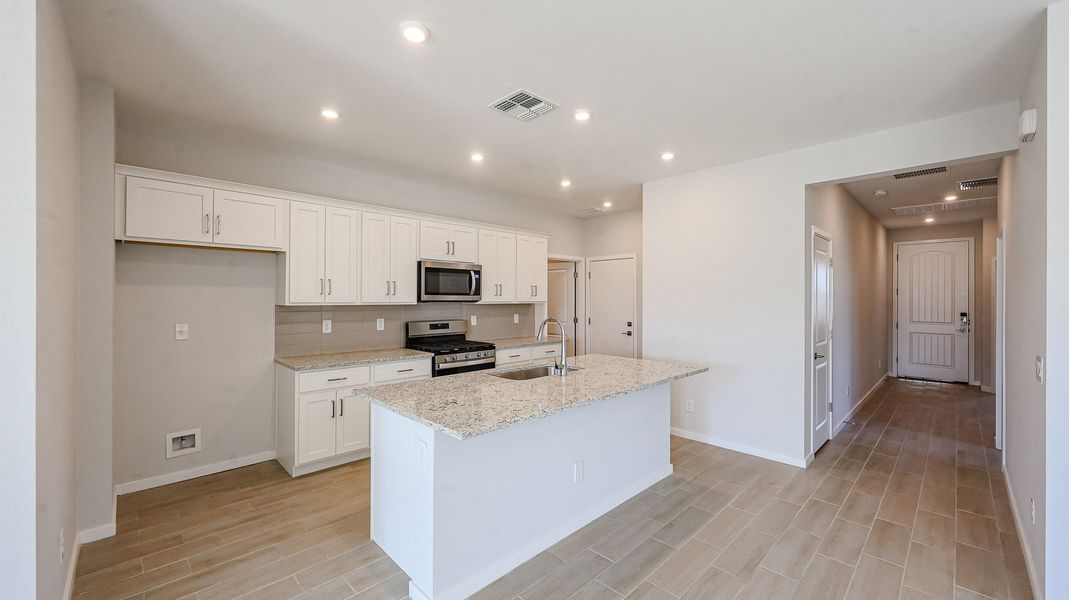 A kitchen with white cabinets. A kitchen with white cabinets.
