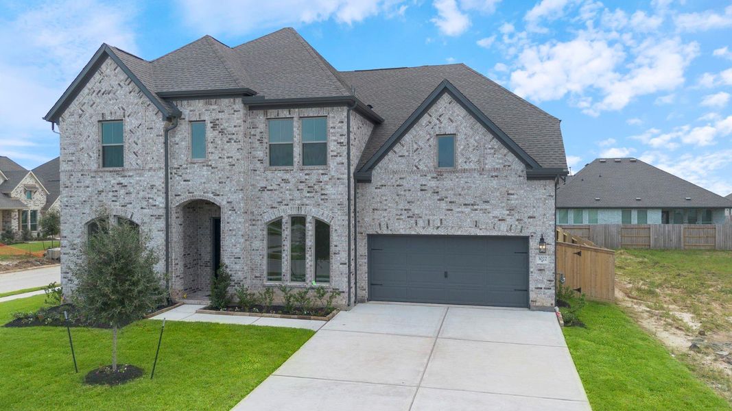 Front exterior of a new home in Coastal Point, League City, TX, highlighting curb appeal (Image 18). Front exterior of a new home in Coastal Point, League City, TX, highlighting curb appeal (Image 18).