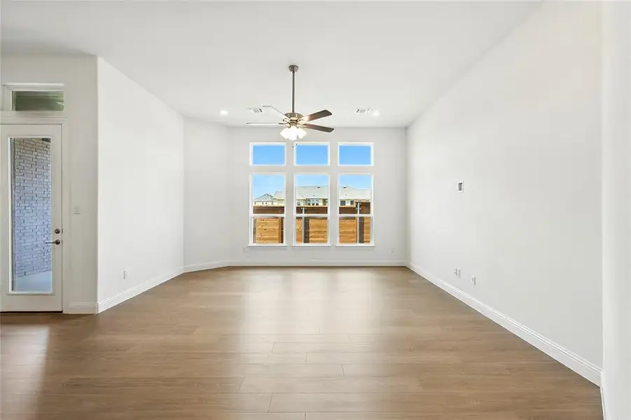 Spare room with light wood-style flooring, recessed lighting, and a ceiling fan