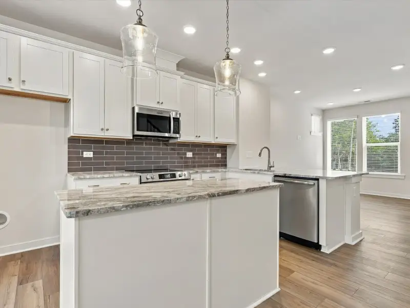 Furnished interior view inside a new home in Central Living at Craig, Charlotte (Image 7).