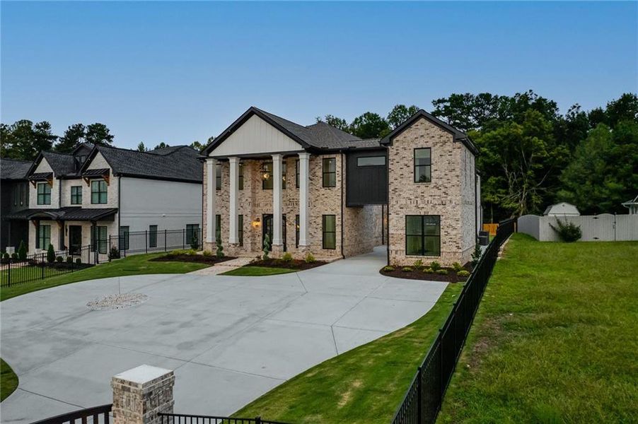 Front exterior of a new home in , Buford, GA, highlighting curb appeal (Image 30). Front exterior of a new home in , Buford, GA, highlighting curb appeal (Image 30).