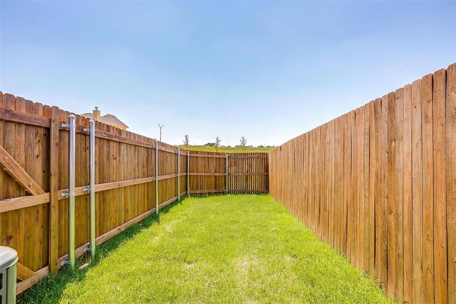 View of fenced backyard
