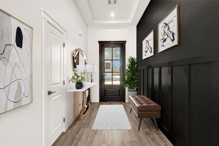 Foyer features tray ceiling and accent wall (digitally staged photo) Foyer features tray ceiling and accent wall (digitally staged photo)