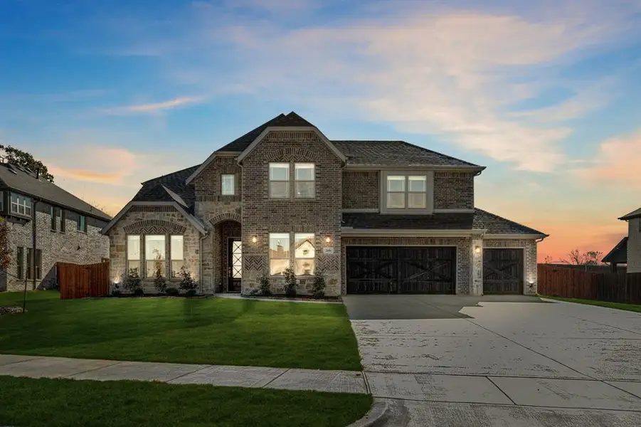 Front exterior of a new home in Triple Diamond Ranch, Mansfield, TX, highlighting curb appeal (Image 2).