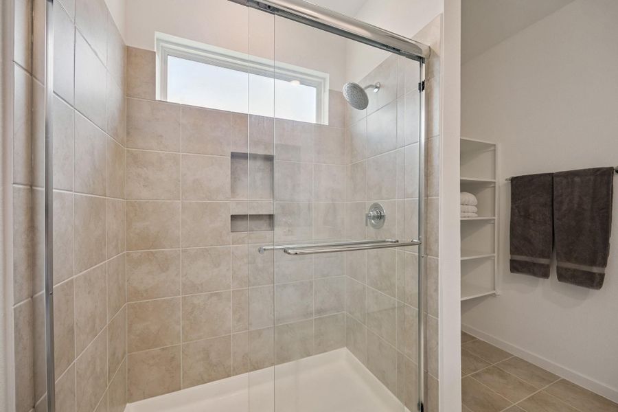 Spacious walk-in shower in the Primary Bathroom - perfect way to begin your day.
