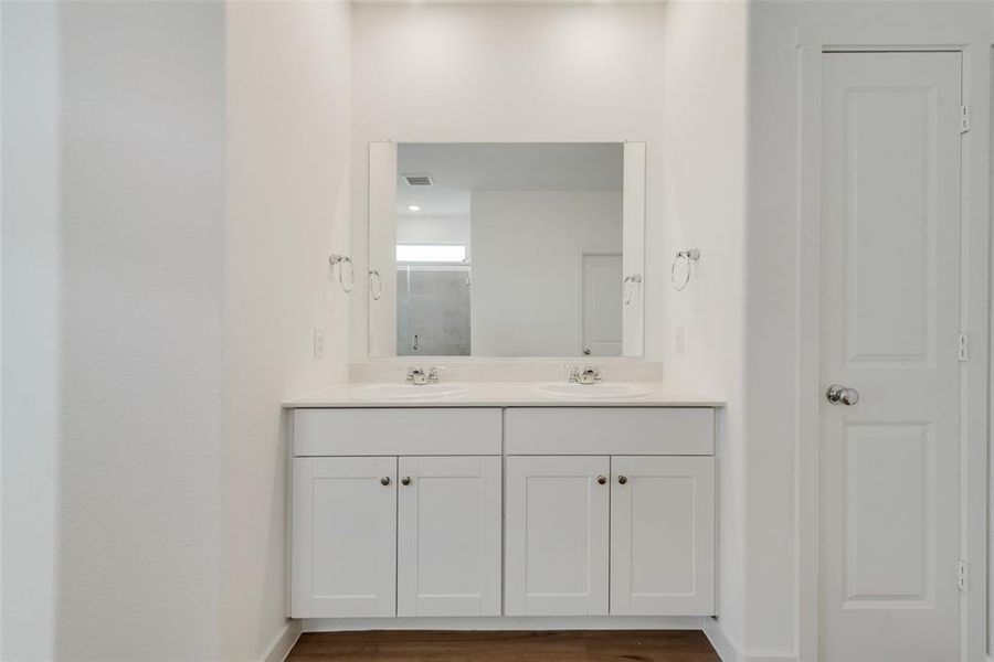 Bathroom featuring vanity and hardwood / wood-style flooring