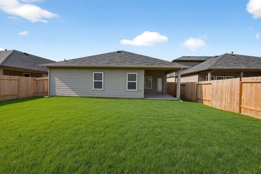 Exterior details and patio area of a home in Grand Pines, Magnolia (Image 4).