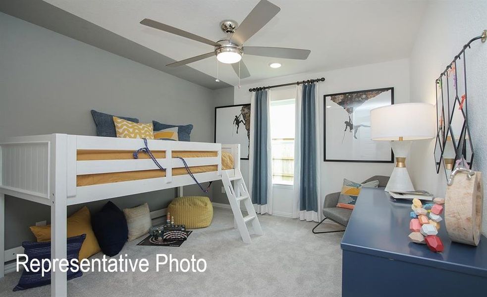 Carpeted room featuring a ceiling fan with integrated lighting, recessed lighting, and a window with curtain rods