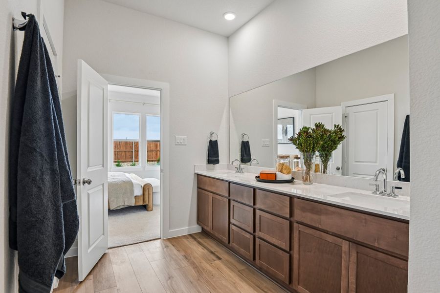 A bathroom with a large mirror.