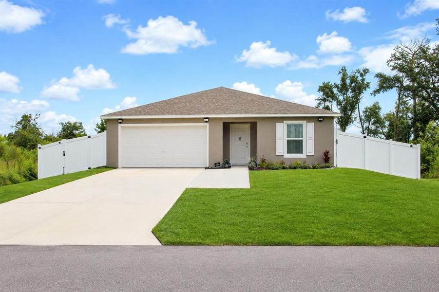 Front exterior of a new home in Poinciana, Poinciana, FL, highlighting curb appeal (Image 2). Front exterior of a new home in Poinciana, Poinciana, FL, highlighting curb appeal (Image 2).