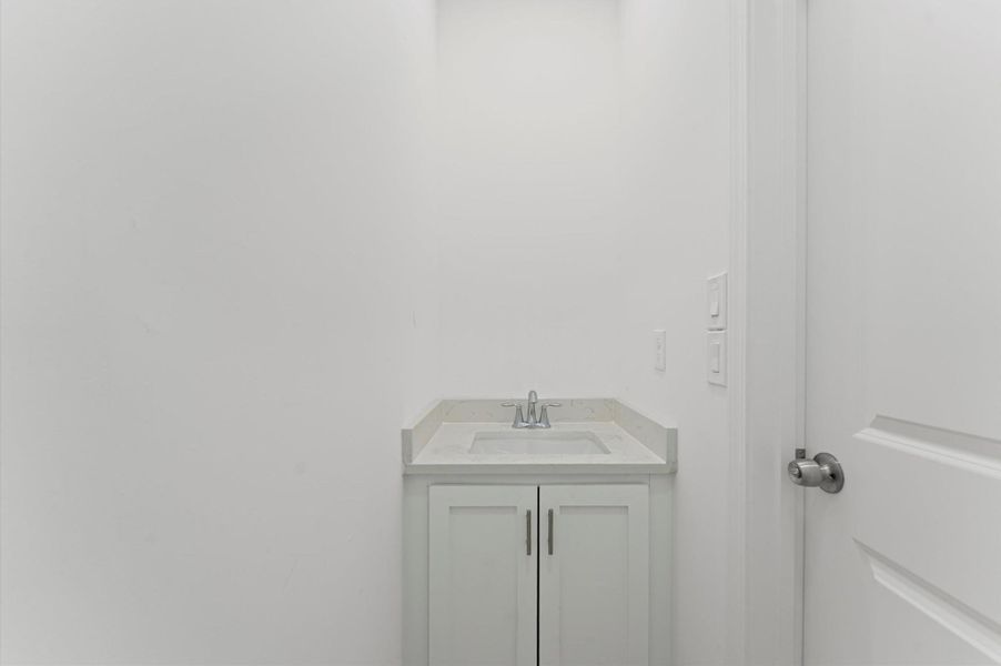 Extra half bathroom in the garage area.