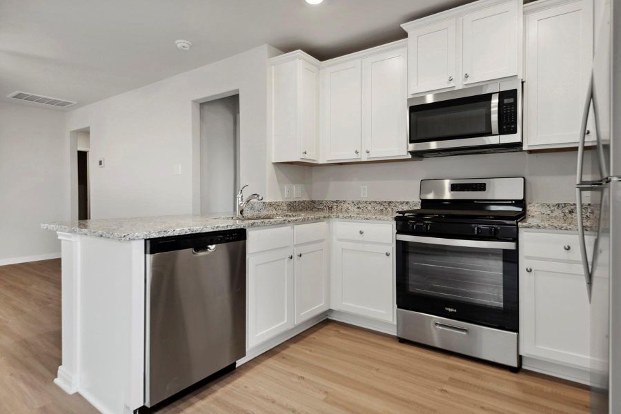Furnished interior view inside a new home in Sweetwater Ridge, Conroe (Image 3).
