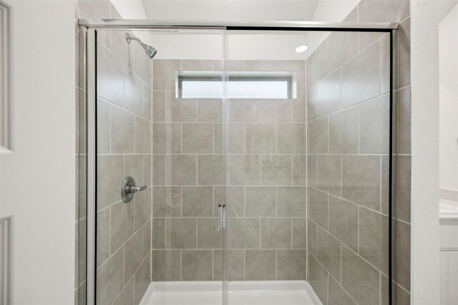Full bathroom featuring a stall shower Full bathroom featuring a stall shower