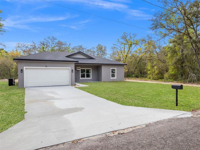 Front exterior of a new home in , Ocklawaha, FL, highlighting curb appeal (Image 21).