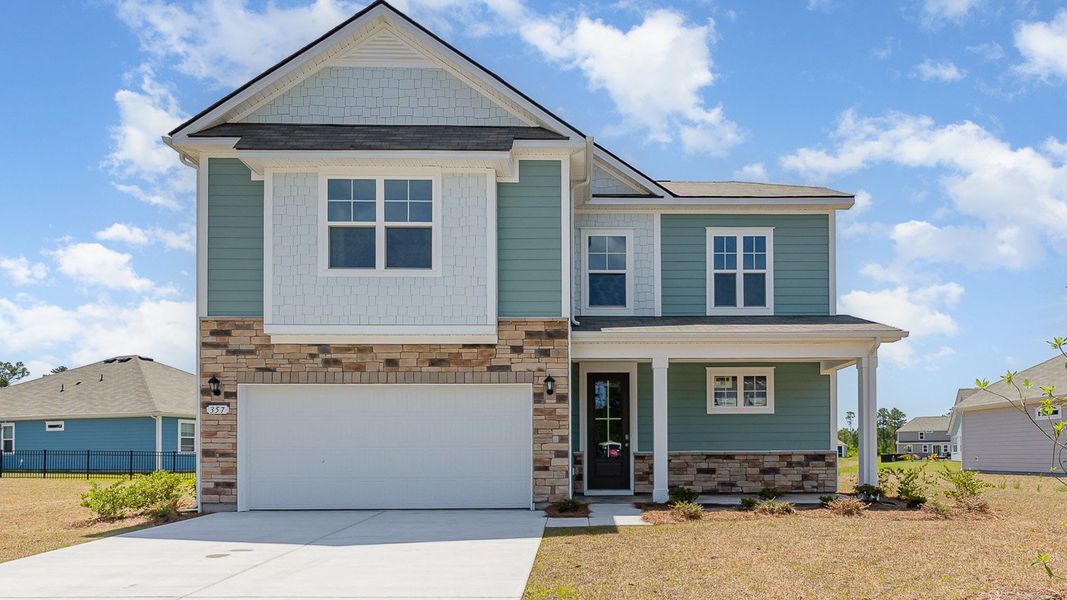 Front exterior of a new home in Heron Pointe, Myrtle Beach, SC, highlighting curb appeal (Image 1). Front exterior of a new home in Heron Pointe, Myrtle Beach, SC, highlighting curb appeal (Image 1).
