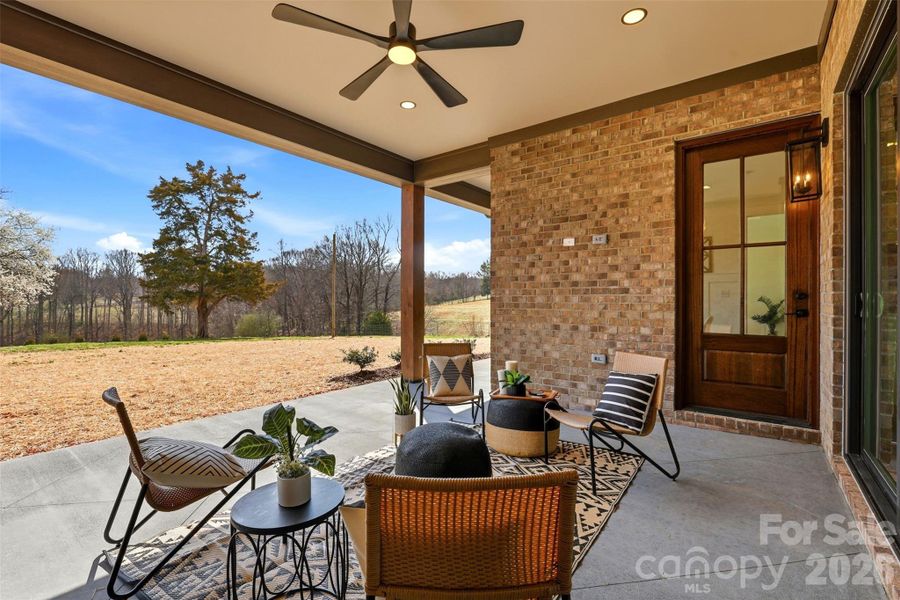 covered rear porch- great for outdoor entertaining or simply taking in the picturesque country views!