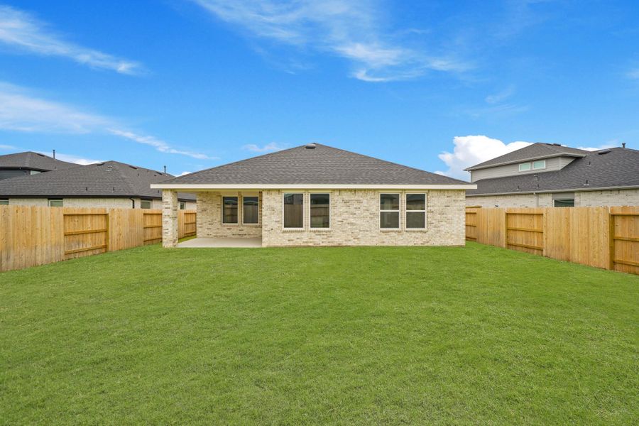 Exterior details and patio area of a home in Sunterra, Katy (Image 4).
